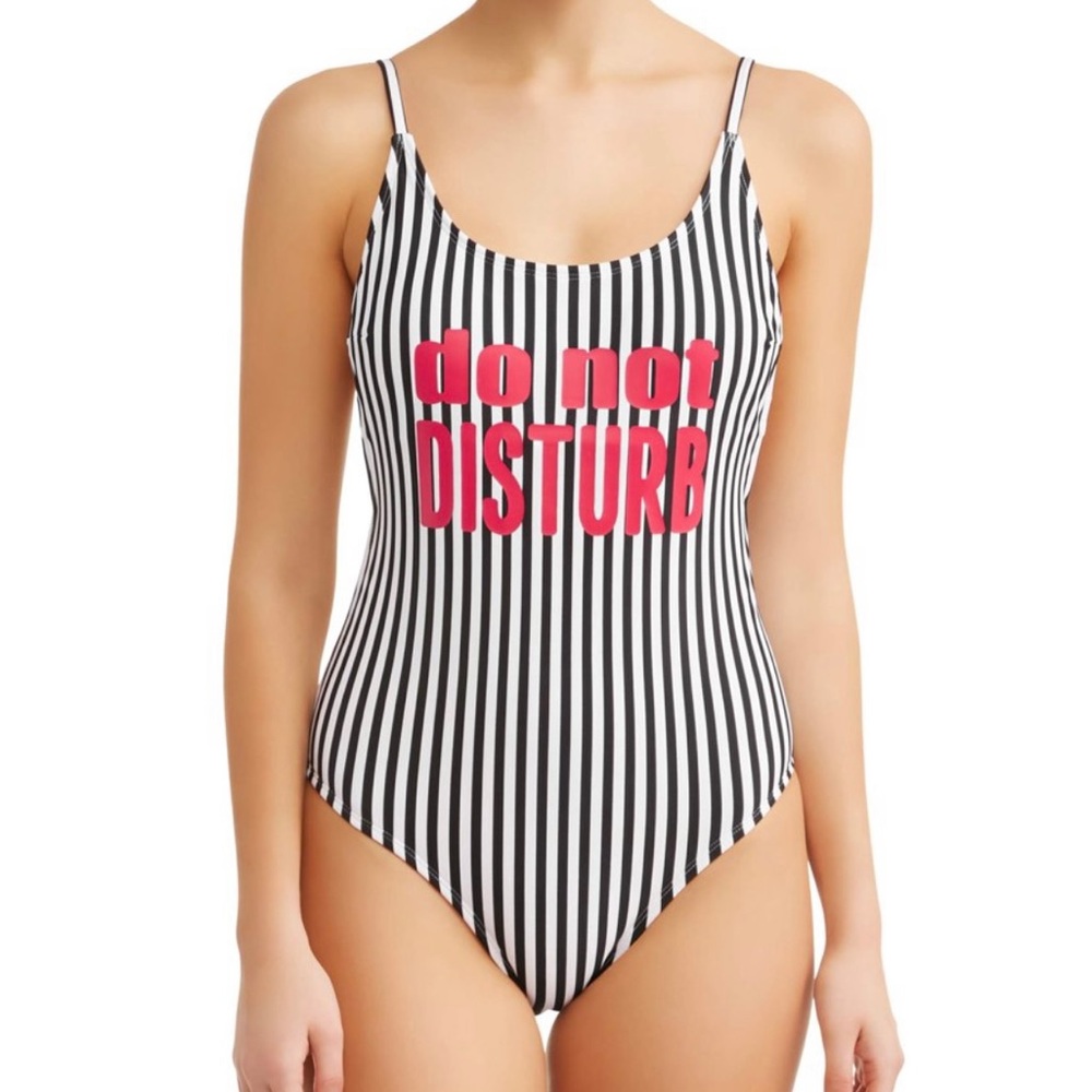 Swim suit. New with tags. Size Medium (7-9)